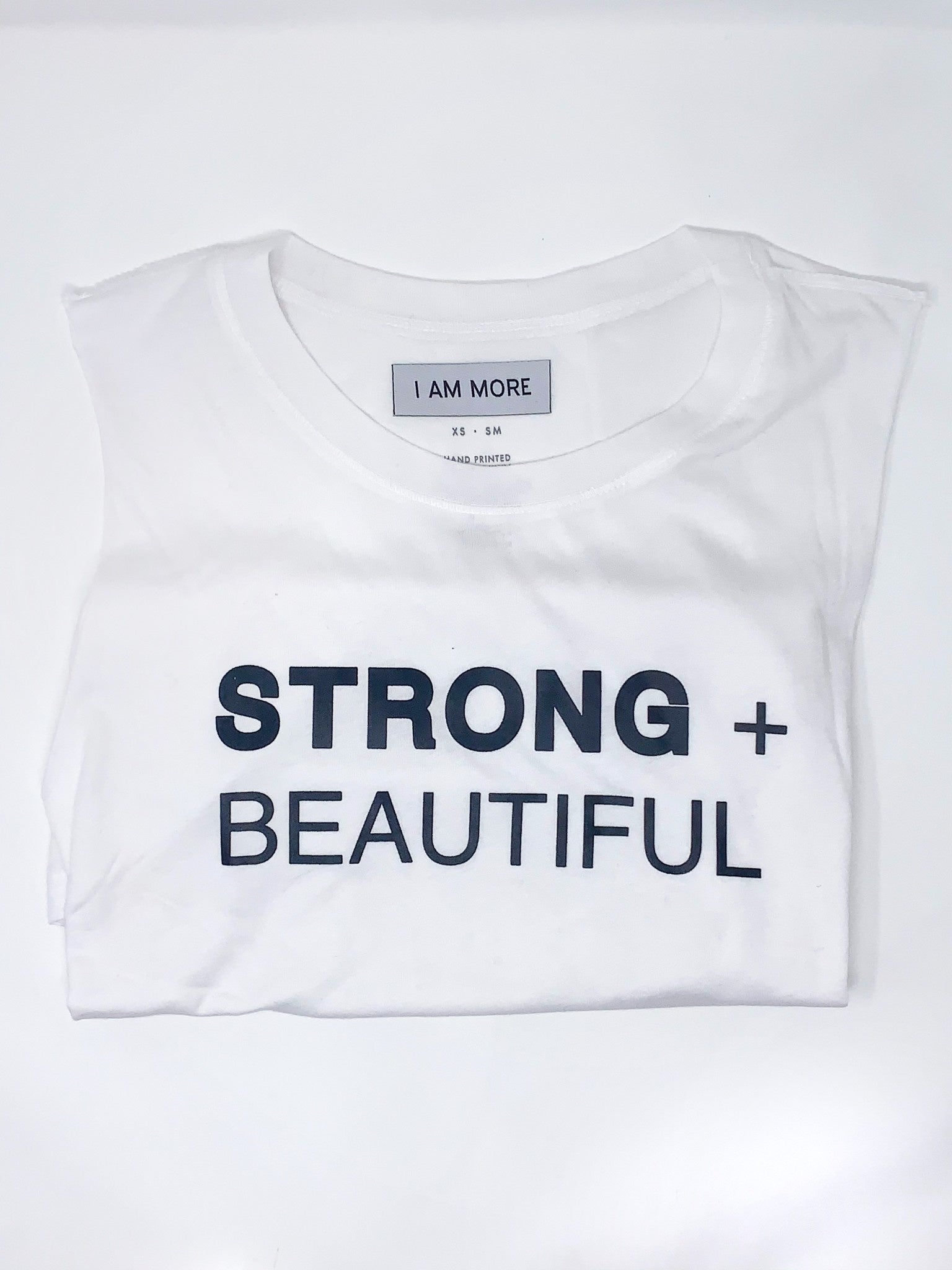I Am More Strong + Beautiful muscle t-shirt in white folded