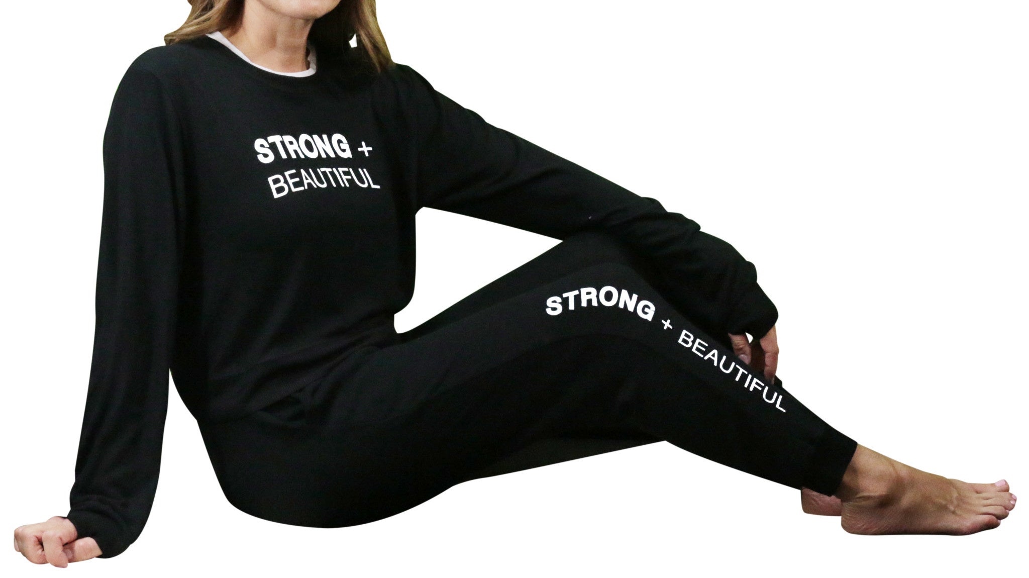Strong + Beautiful Sweatpants on model laying down